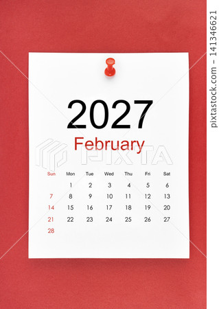 February 2027 calendar page with push pin on red color background. February 2027 calendar page with push pin on red color background. 141346621