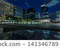 The illuminated fountain at Wadakura Fountain Park and the skyscrapers of Marunouchi, December 2023. 141346789