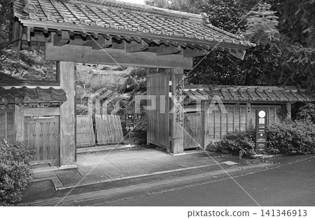 A majestic Yakui-mon gate; a dignified wooden main gate that evokes the breath of history, surrounded by lush greenery. A majestic Yakui-mon gate; a dignified wooden main gate that evokes the breath of history, surrounded by lush greenery. 141346913