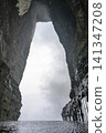 Huge arch of the 'Heavenly Gate' in the fog in the Tianmenshan Mountains near Zhangjajie, China 141347208