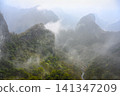 View of the Tianmenshan Mountains in the fog near Zhangjiajie in China 141347209