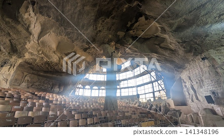 A big rock cross in the center in one of the cave churches A big rock cross in the center in one of the cave churches 141348196