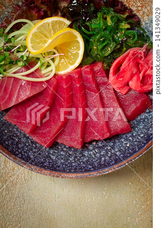 tuna sashimi with daikon and wakame salad, pickled ginger, in a bowl, tuna sashimi with daikon and wakame salad, pickled ginger, in a bowl, 141349029