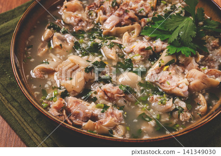 Muzhuzhi, a Georgian dish made from pork legs, with spices and herbs, homemade Muzhuzhi, a Georgian dish made from pork legs, with spices and herbs, homemade 141349030
