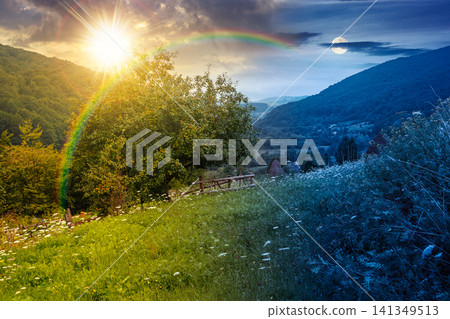 rural mountain landscape of ukraine at twilight. countryside scenery of transcarpathia in summer. night meet day concept. forested hills and grassy meadows under epic sky rural mountain landscape of ukraine at twilight. countryside scenery of transcarpathia in summer. night meet day concept. forested hills and grassy meadows under epic sky 141349513
