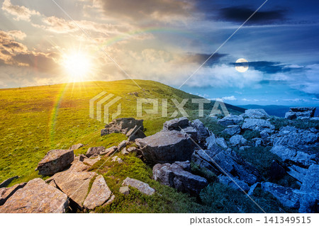 carpathian mountain landscape on summer solstice. amazing background for outdoor adventure at twilight. transcarpathia green hill with rocks. day and night time change metaphor carpathian mountain landscape on summer solstice. amazing background for outdoor adventure at twilight. transcarpathia green hill with rocks. day and night time change metaphor 141349515