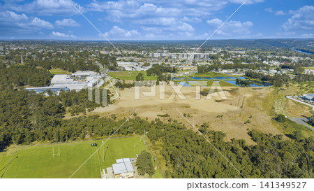 Drone aerial photograph of several sports fields and industrial buildings Drone aerial photograph of several sports fields and industrial buildings 141349527