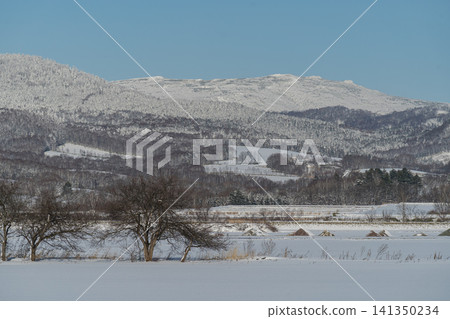 Hills covered in frost and snowy countryside Hills covered in frost and snowy countryside 141350234