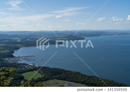 A waterside town and cape viewed from a hill. A waterside town and cape viewed from a hill. 141350509