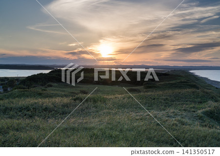A hill in the wilderness, hazy with the setting sun A hill in the wilderness, hazy with the setting sun 141350517