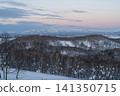 A sky tinged pink and snow-capped mountains 141350715