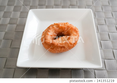 A classic donut placed on the table A classic donut placed on the table 141351219