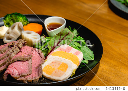 Roast beef and terrine served on a restaurant lunch plate. Roast beef and terrine served on a restaurant lunch plate. 141351648