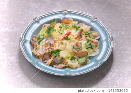 Pasta dish, spaghetti with cabbage, clams, and anchovies, Italian food. Clams and cabbage. Pasta dish, spaghetti with cabbage, clams, and anchovies, Italian food. Clams and cabbage. 141353615