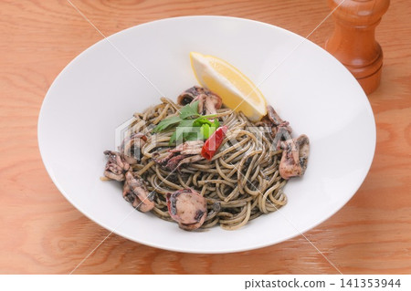 Squid ink pasta, squid ink spaghetti, Italian food, seafood pasta, squid ink dishes. Squid ink pasta, squid ink spaghetti, Italian food, seafood pasta, squid ink dishes. 141353944