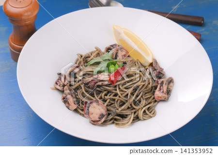 Squid ink pasta, squid ink spaghetti, Italian food, seafood pasta, squid ink dishes. Squid ink pasta, squid ink spaghetti, Italian food, seafood pasta, squid ink dishes. 141353952