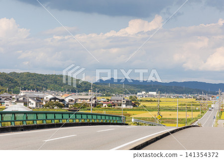 Golden rice fields viewed from Nanago Bridge (Nishiwaki-cho, Ono City, Hyogo Prefecture) Golden rice fields viewed from Nanago Bridge (Nishiwaki-cho, Ono City, Hyogo Prefecture) 141354372