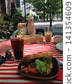 BLT sandwich eaten on a cafe terrace. 141354609