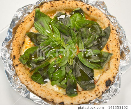 Margherita pizza with extra basil, home-cooked meal prepared by my wife, dinner enjoyed at home, happy family Margherita pizza with extra basil, home-cooked meal prepared by my wife, dinner enjoyed at home, happy family 141355192
