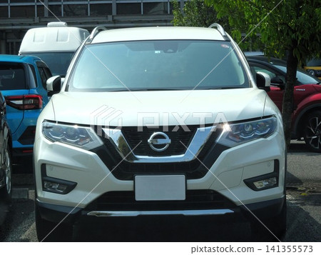 Passenger car parked in a parking lot Passenger car parked in a parking lot 141355573