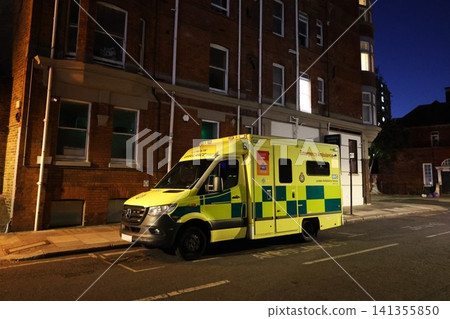 An ambulance parked in the streets of London, England at night. An ambulance parked in the streets of London, England at night. 141355850