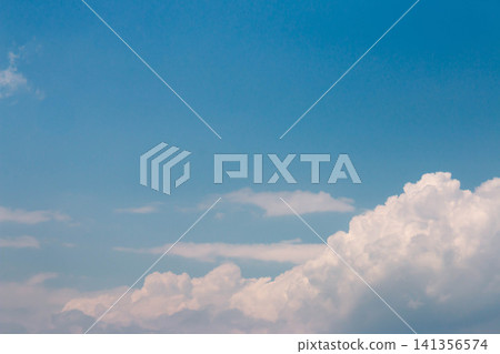 Background image of cumulonimbus clouds floating in the summer sky and a blue sky. Background image of cumulonimbus clouds floating in the summer sky and a blue sky. 141356574