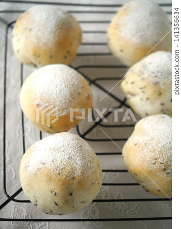 Freshly baked black sesame round bread Freshly baked black sesame round bread 141356634