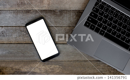 Laptop and Smartphone Blank Screens on Rustic Wooden Desk Laptop and Smartphone Blank Screens on Rustic Wooden Desk 141356791