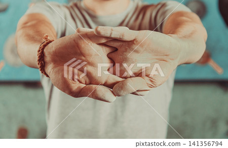 Chalky Athlete Hands in Close-Up Before Sports Training Chalky Athlete Hands in Close-Up Before Sports Training 141356794