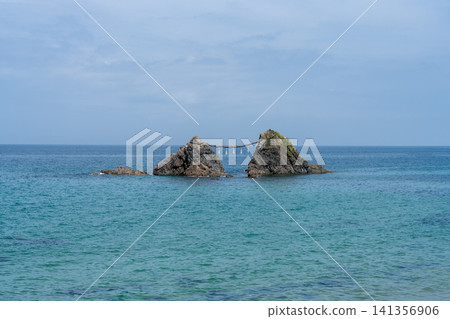 Meotoiwa (Husband and Wife Rocks), a famous scenic spot in Itoshima City, Fukuoka Prefecture, standing in the blue sea. Meotoiwa (Husband and Wife Rocks), a famous scenic spot in Itoshima City, Fukuoka Prefecture, standing in the blue sea. 141356906