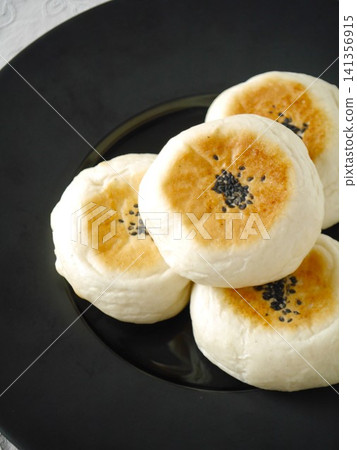 Flat-baked sweet bean paste bun Flat-baked sweet bean paste bun 141356915