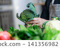 Choosing Fresh Green Vegetables for Healthy Aging Lifestyle 141356982