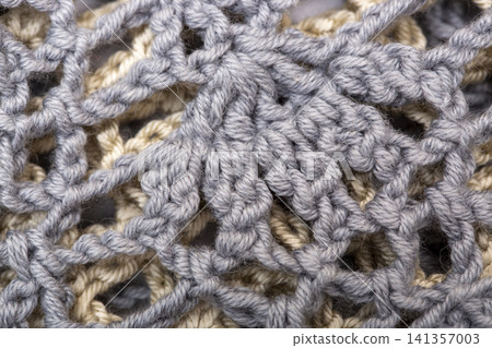 Background from a fragment of a garment knitted with cotton yarn 141357003