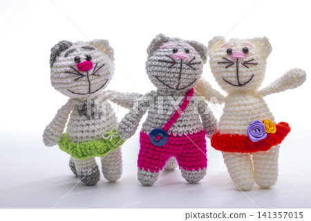 A crocheted cat toy on a white background A crocheted cat toy on a white background 141357015