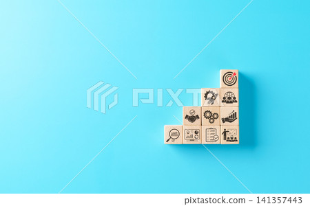 Business development strategy and planning concept. Wooden blocks stacked as steps with business icons including handshake, target, gears, rocket, growth charts. Symbol of progress, success strategy. Business development strategy and planning concept. Wooden blocks stacked as steps with business icons including handshake, target, gears, rocket, growth charts. Symbol of progress, success strategy. 141357443