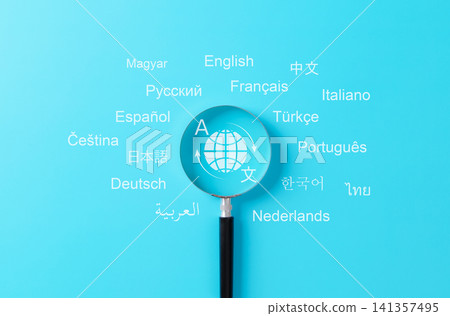 Multilingual language translation technology concept. Magnifying glass focusing on global translation icon surrounded by words in various international languages. translate, multilingual communication Multilingual language translation technology concept. Magnifying glass focusing on global translation icon surrounded by words in various international languages. translate, multilingual communication 141357495