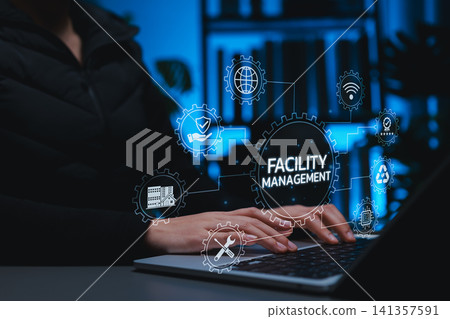 Professional using digital facility management system on laptop, representing smart building maintenance, infrastructure operations, sustainability, safety, and property technology solutions. Professional using digital facility management system on laptop, representing smart building maintenance, infrastructure operations, sustainability, safety, and property technology solutions. 141357591