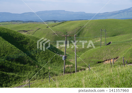 A hilly area stretching along the Aso Milk Road under a clear blue sky, Kumamoto Prefecture A hilly area stretching along the Aso Milk Road under a clear blue sky, Kumamoto Prefecture 141357960
