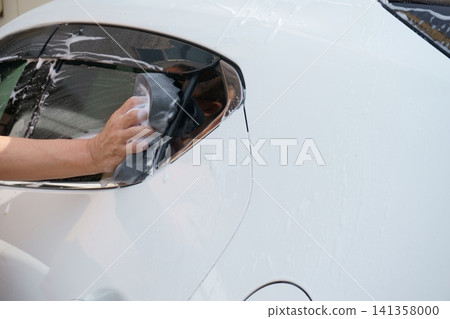 Washing car windows Washing car windows 141358000