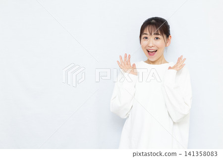 Smiling and surprised woman Smiling and surprised woman 141358083