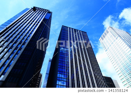 Looking up at skyscrapers Looking up at skyscrapers 141358124