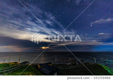 A starry landscape of Erimo Town, Hokkaido, where countless stars shine above the rocky reefs of the Pacific Ocean. A starry landscape of Erimo Town, Hokkaido, where countless stars shine above the rocky reefs of the Pacific Ocean. 141358468