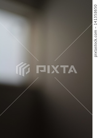 Abstract background material featuring soft natural light and shadows streaming in through a window (vertical orientation) Abstract background material featuring soft natural light and shadows streaming in through a window (vertical orientation) 141358650