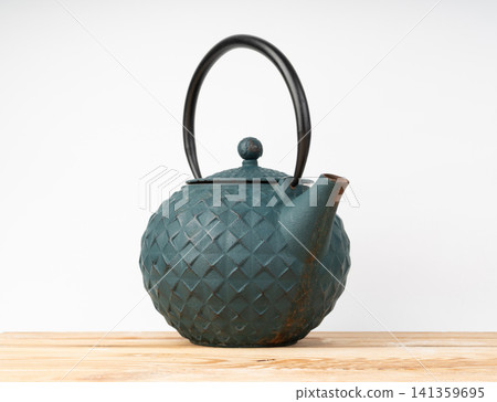 Antique iron teapot. Chinese dark green kettle, metal heavy Japanese tea pot Antique iron teapot. Chinese dark green kettle, metal heavy Japanese tea pot 141359695