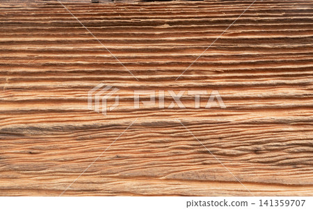 Old wood textured background. Dark driftwood surface, burnt wood brushing, macro brown floor Old wood textured background. Dark driftwood surface, burnt wood brushing, macro brown floor 141359707