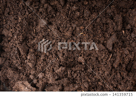 Peat soil textured background. Compost pile, brown garden dirt mound Peat soil textured background. Compost pile, brown garden dirt mound 141359715