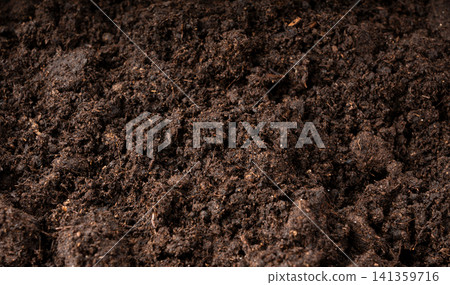 Peat soil textured background. Compost pile, brown garden dirt mound Peat soil textured background. Compost pile, brown garden dirt mound 141359716