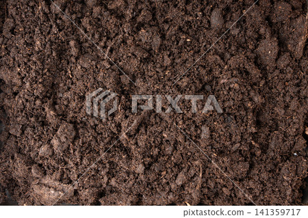 Peat soil textured background. Compost pile, brown garden dirt mound Peat soil textured background. Compost pile, brown garden dirt mound 141359717