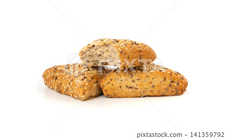 Triangular bun isolated. Wheat bread with sesame and flax seeds, healthy whole grain bakery Triangular bun isolated. Wheat bread with sesame and flax seeds, healthy whole grain bakery 141359792