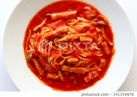 Tomato soup pasta viewed from directly above against a white background. Tomato soup pasta viewed from directly above against a white background. 141359978